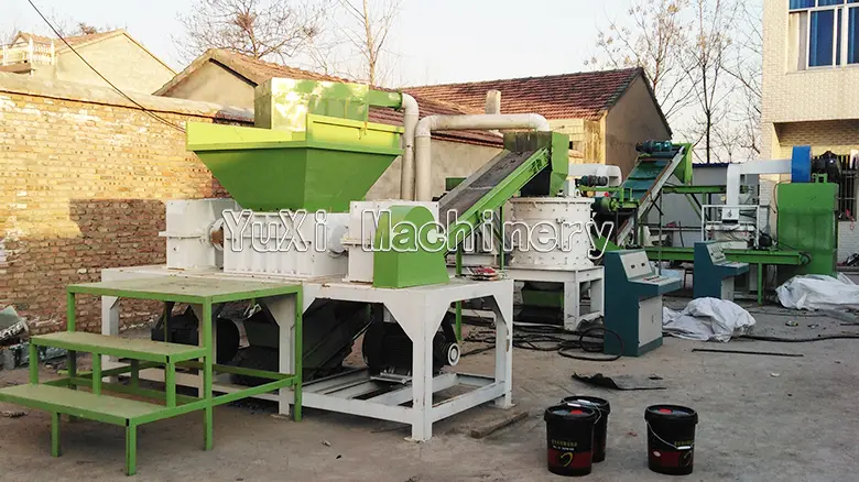 Outdoor setup of the radiator recycling system with shredder and crusher.