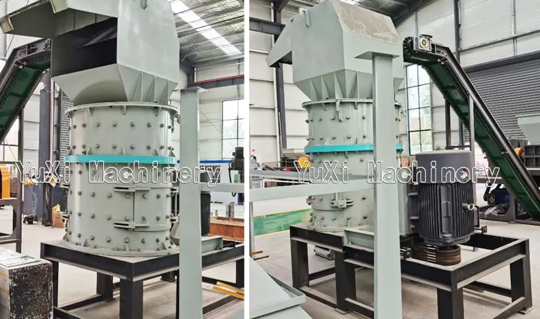 Close-up view of the vertical shaft metal crusher exterior, highlighting the feeding chamber and large electric motor.