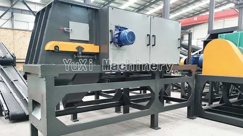 Close-up view of the material feeding end and large housing of the eddy current separator.