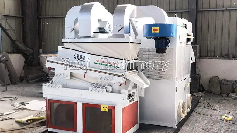 Front view of the air flow gravity separator machine with its dust collection air ducts and high-power fan system.
