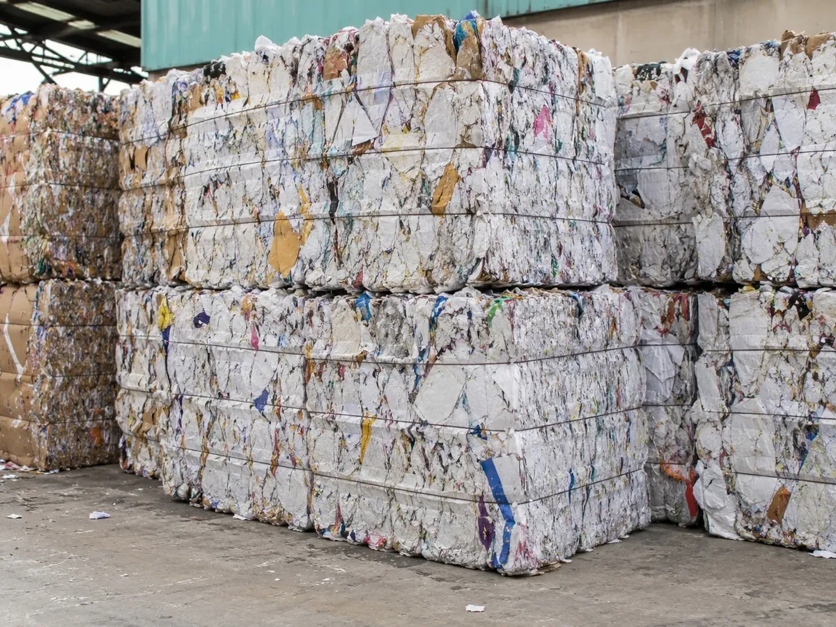 Packaging paper waste for dry fiber recovery