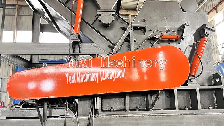 YUXI Hammer Mill Belt Drive and Access Close-up of YUXI hammer mill belt drive guard and hydraulic access components